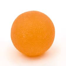 Texture Squeeze Ball orange close up plain white background